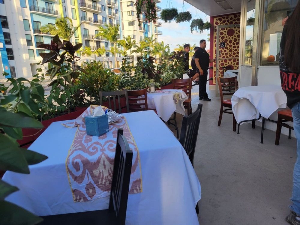 Patio tables with ikat runners outside Grandma's Secret