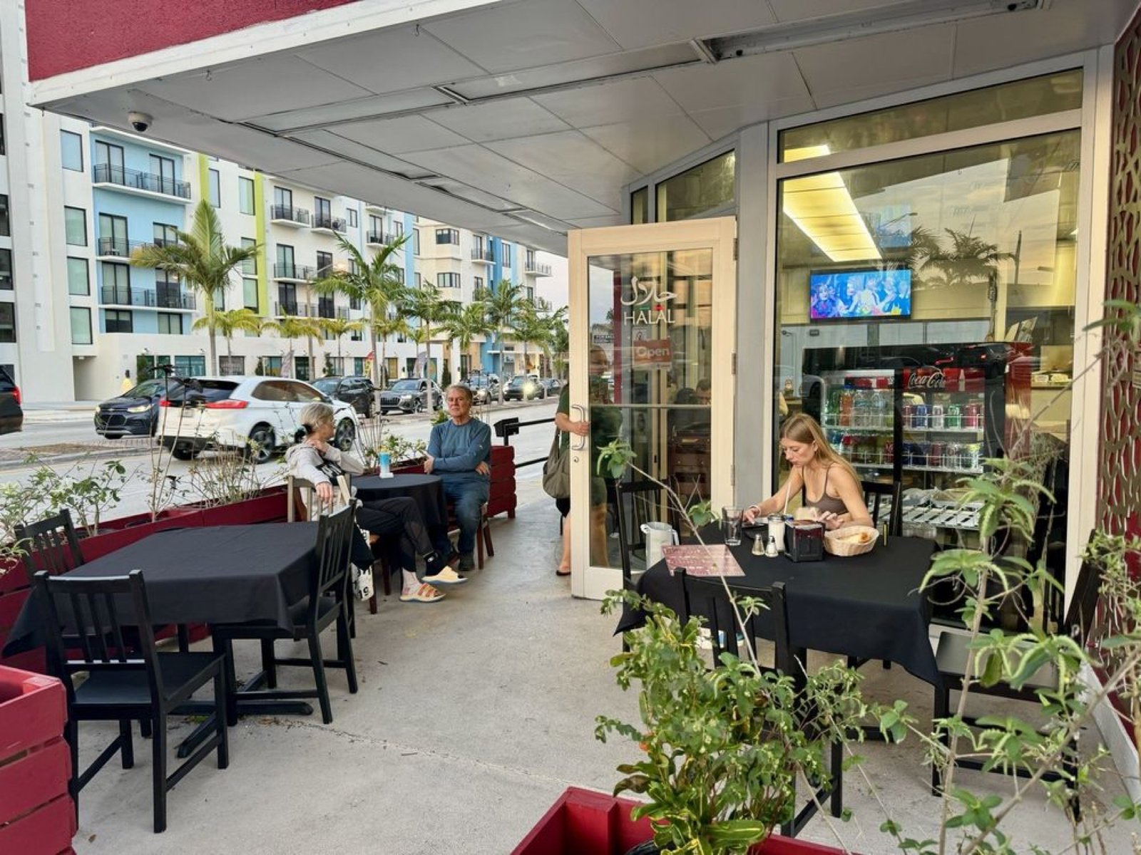 Guests dining on the Grandma's Secret patio in Dania Beach
