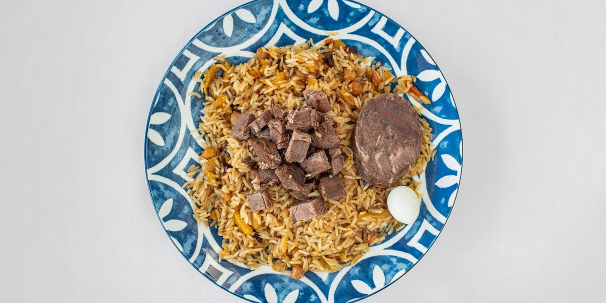 Tashkent Plov on a traditional ceramic plate